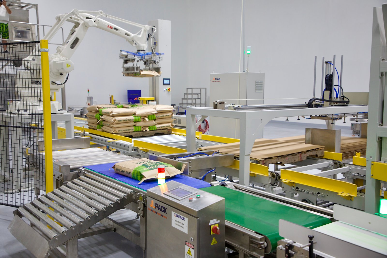 Robotic palletizer stacking 50 lb pure cane sugar sacks