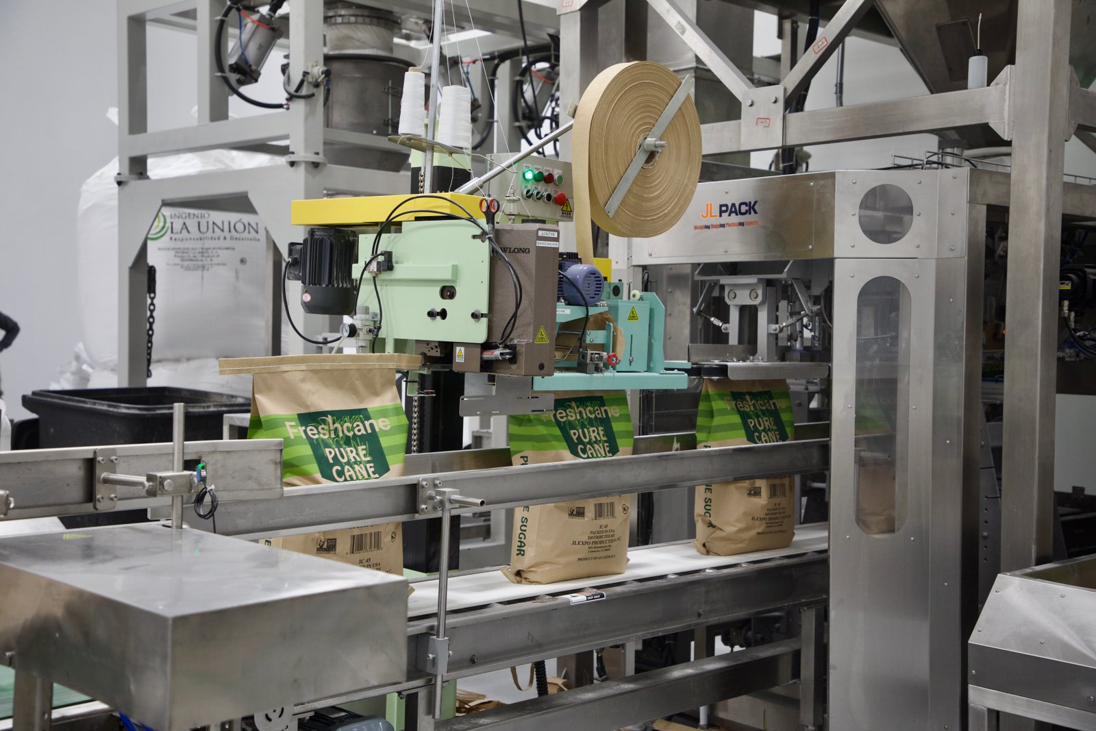 50 lb Freshcane kraft sacks being stitched closed on the packaging line